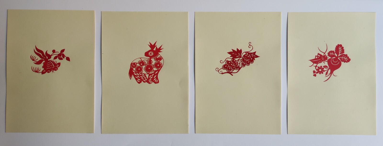 VINTAGE PORTFOLIO ALBUM WITH 16 CHINESE PAPER-CUTS – 1955