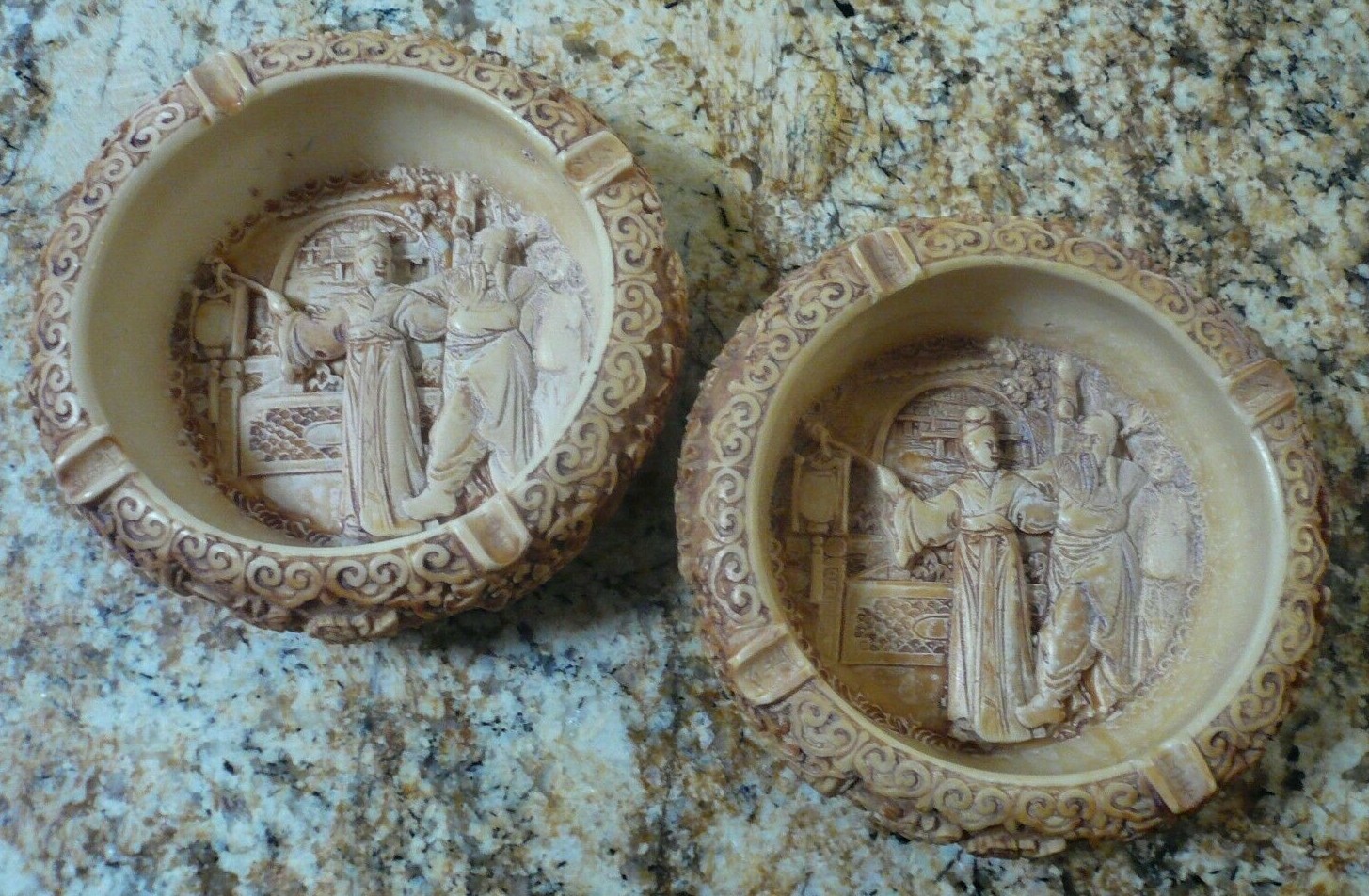 Vintage Chinese Pair of (2) Carved Resin Man Woman Figures Round Ashtrays 8″