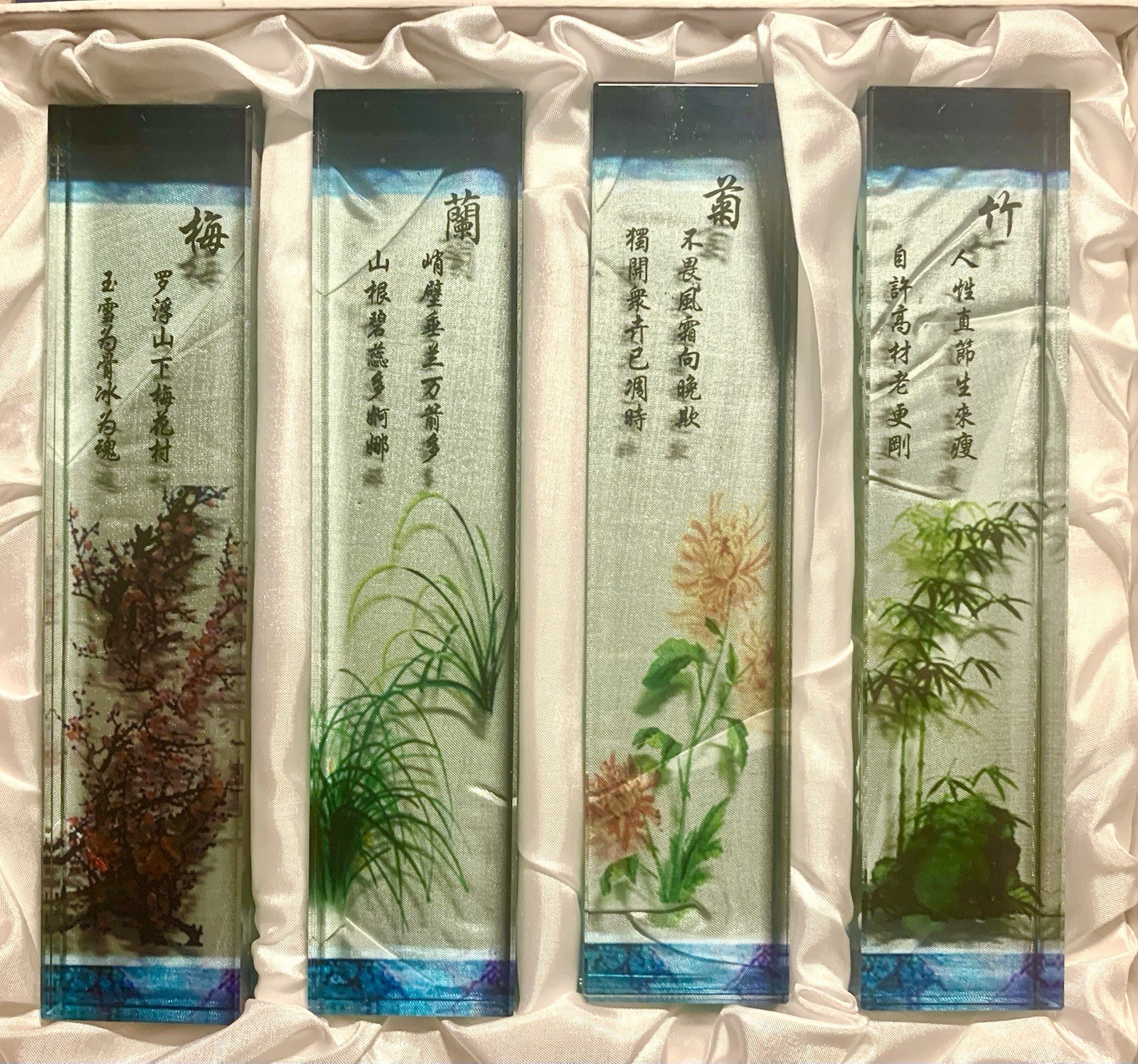 Set of 4 glass Chinese paperweights, each with hand-painted design & text.