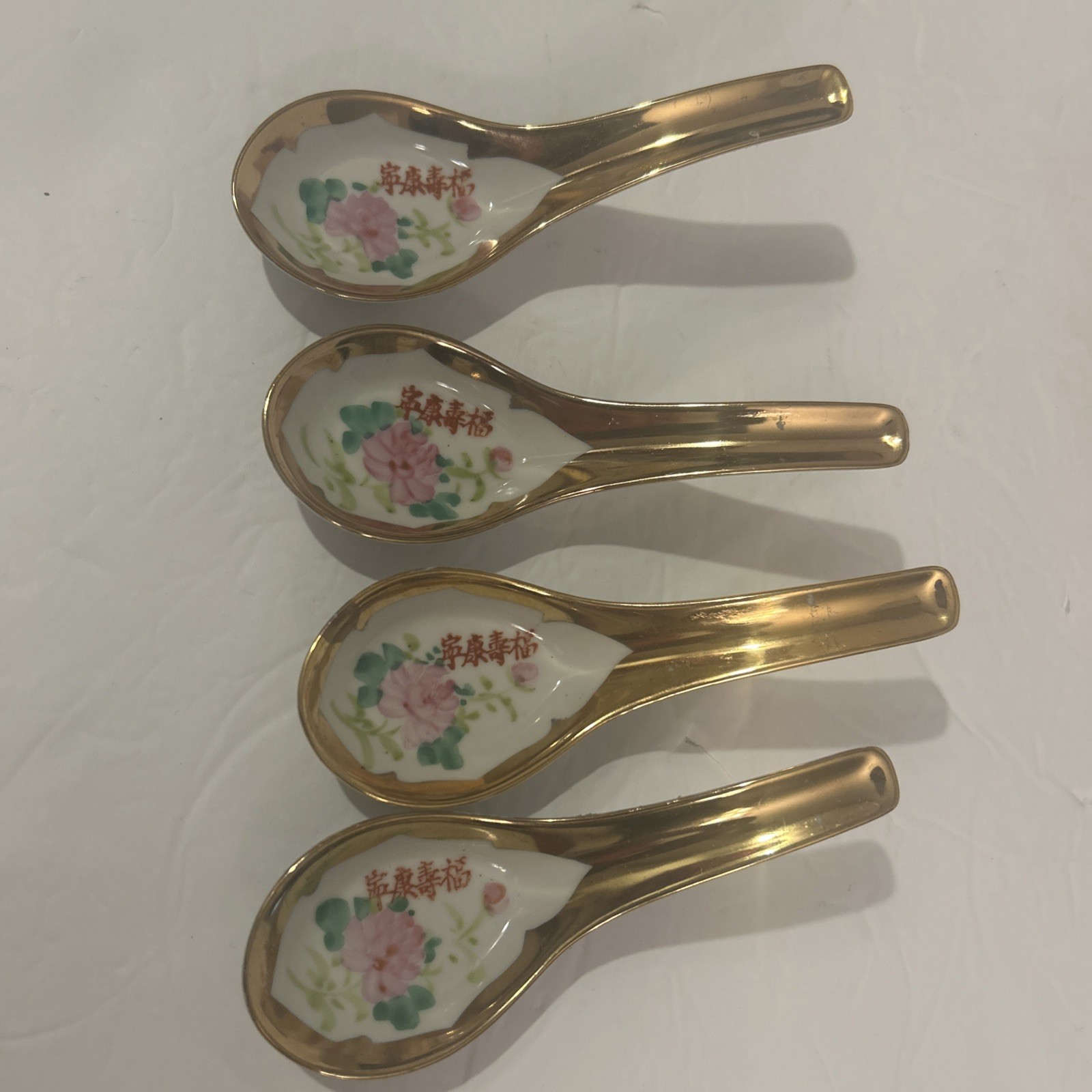 4 Vintage Chinese porcelain Multicolored Flowers 5.5” spoons with Gold Rims