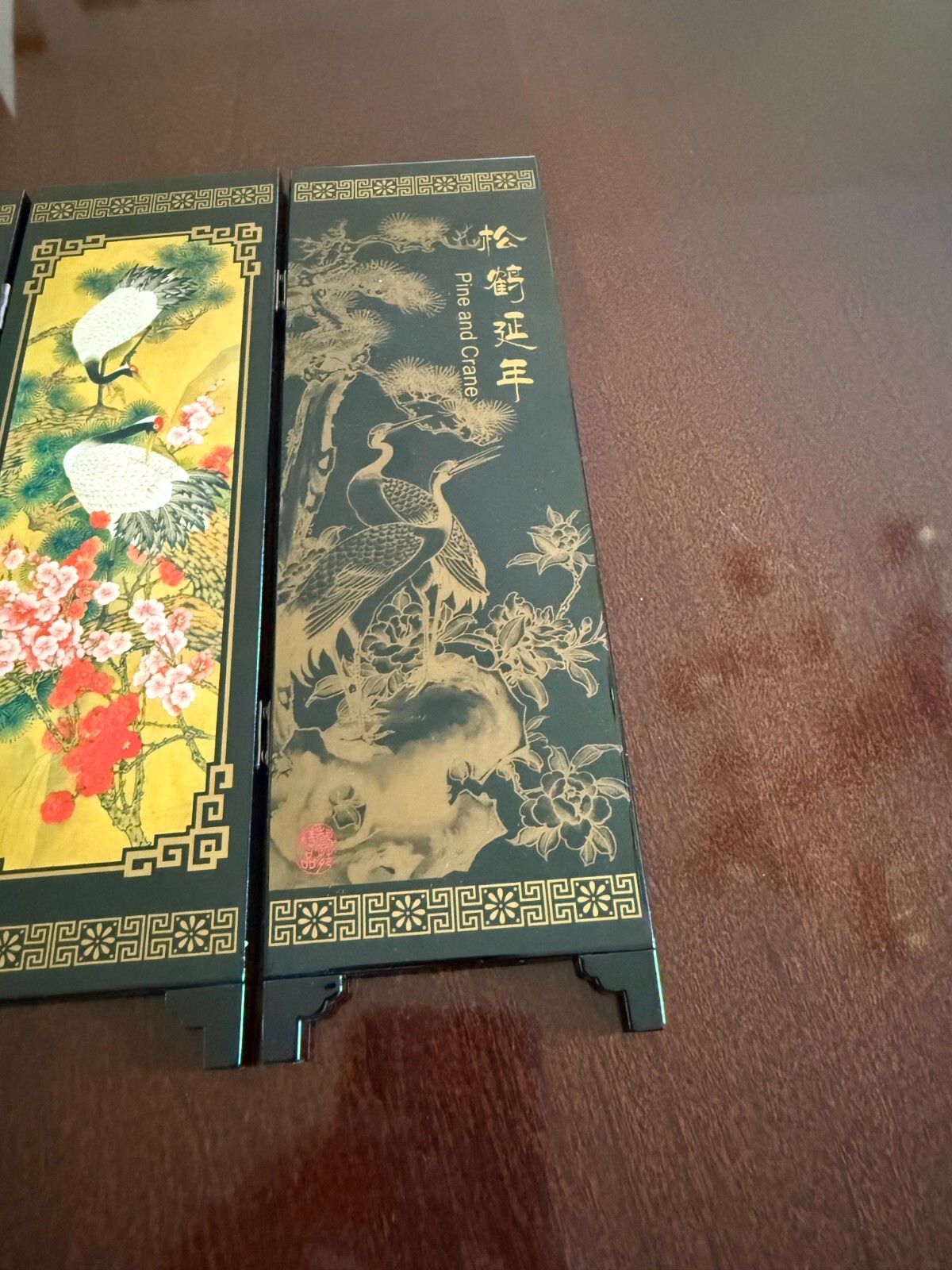 Asian Lacquer Table Folding Screen features a beautiful “Pine & Crane” scenes