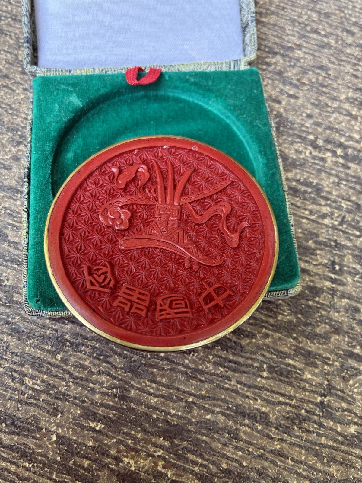 Chinese carved lacquer medallion and ceramic face mask miniatures