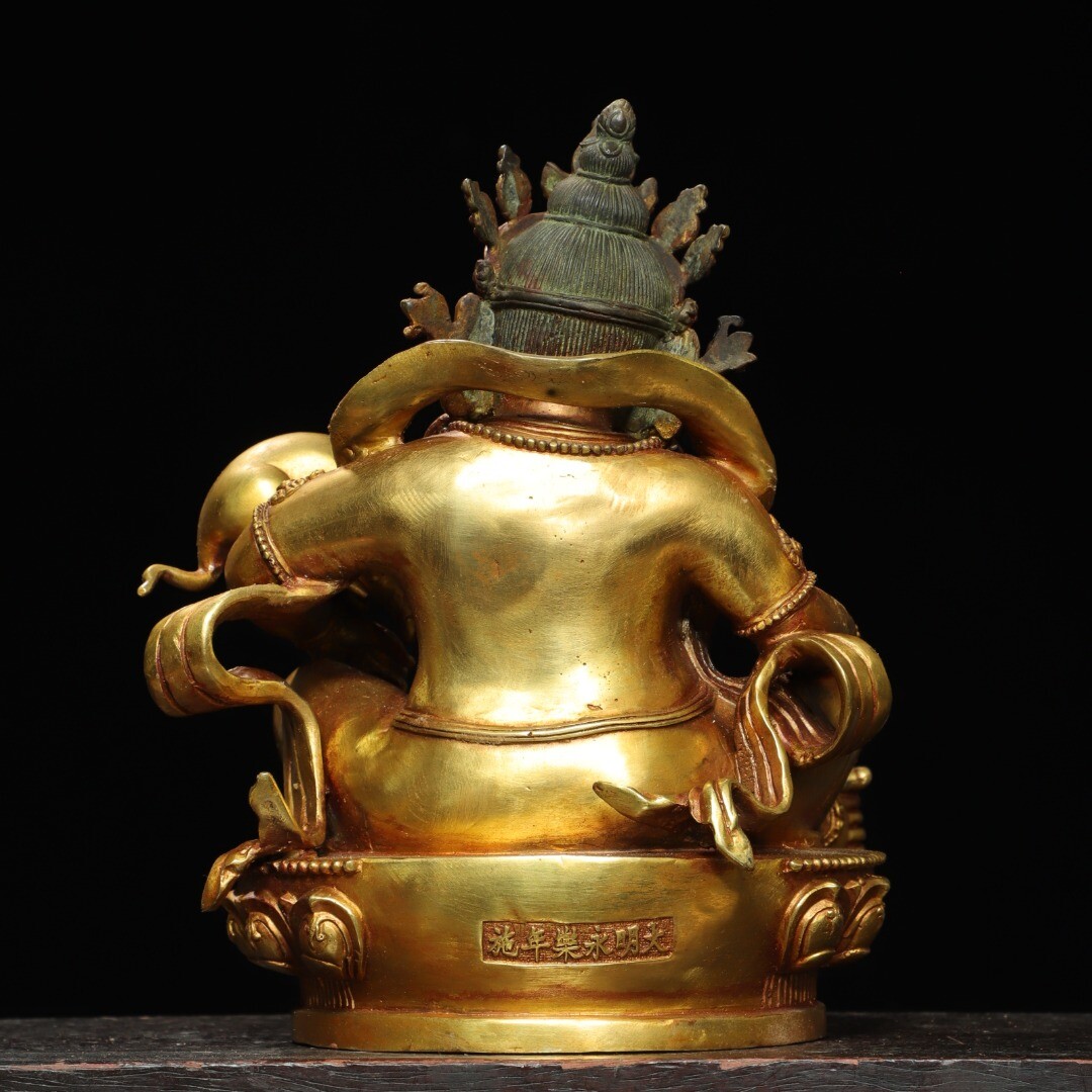 Bronze gilded statue of the Yellow God of Wealth Buddha
