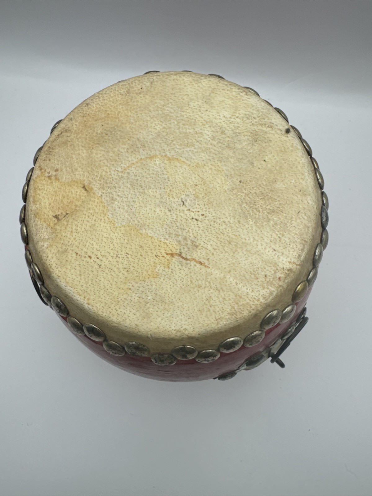 20th Century Chinese Traditional Small Red Tanggu. Wood, Cowhide, Metal 6×6 In.