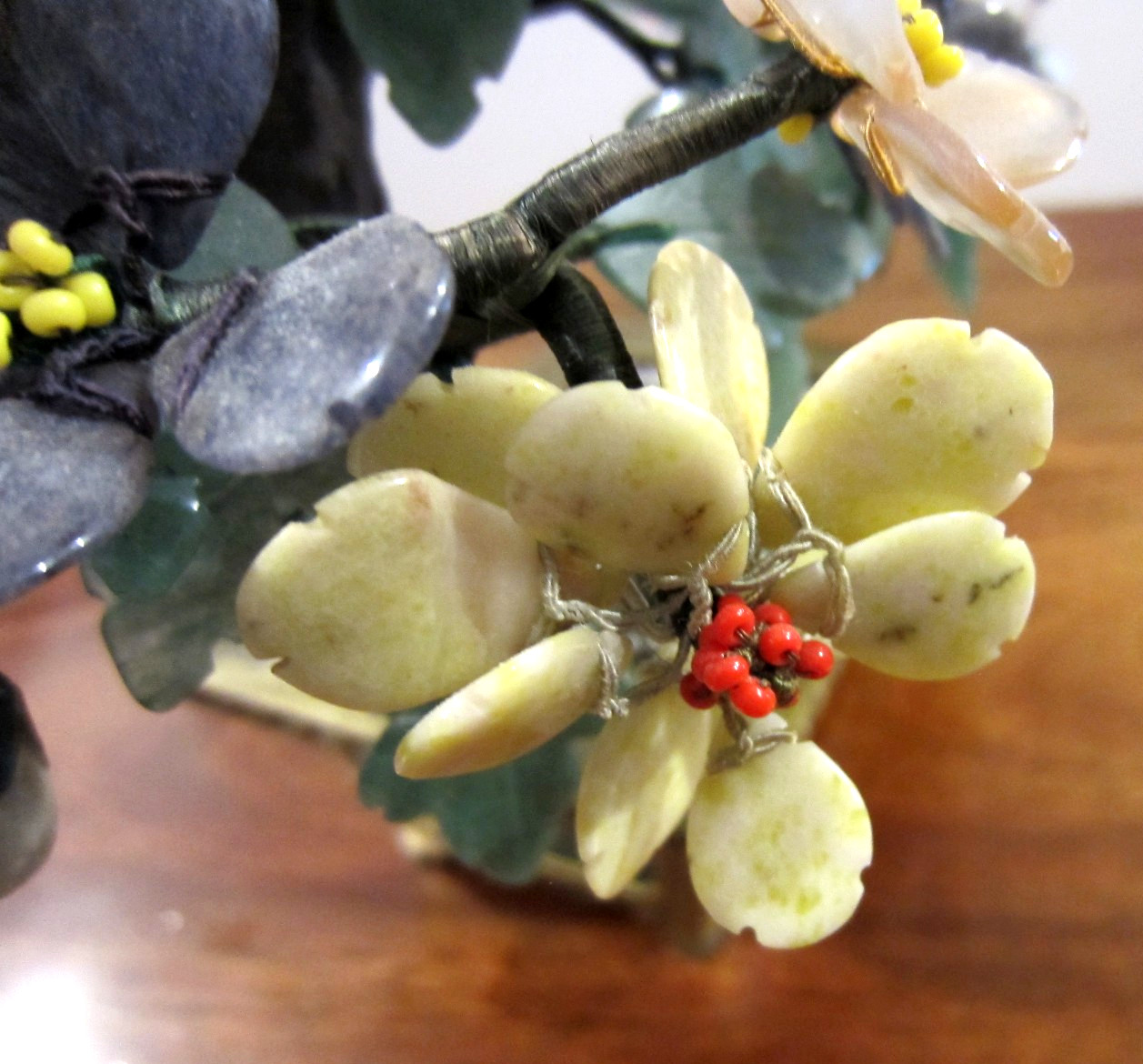 large jade/stone bonsai tree with many flowers of jade, agate, amethyst,& others