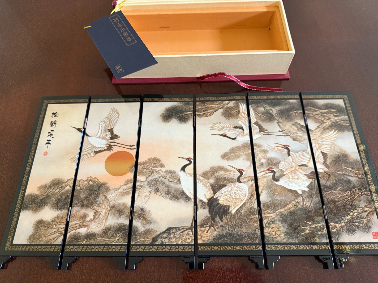 Asian Lacquer Table Folding Screen features a beautiful “Pine & Crane” scenes