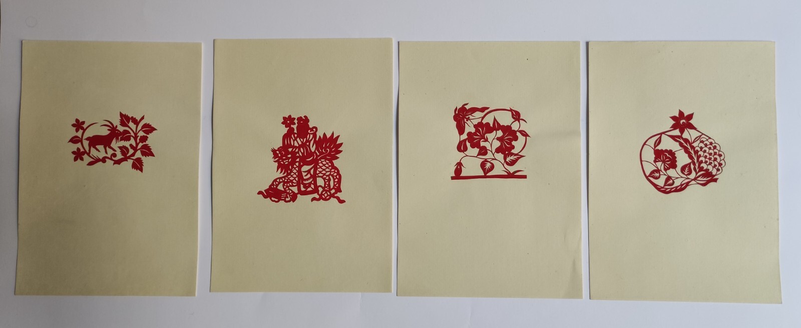 VINTAGE PORTFOLIO ALBUM WITH 16 CHINESE PAPER-CUTS – 1955