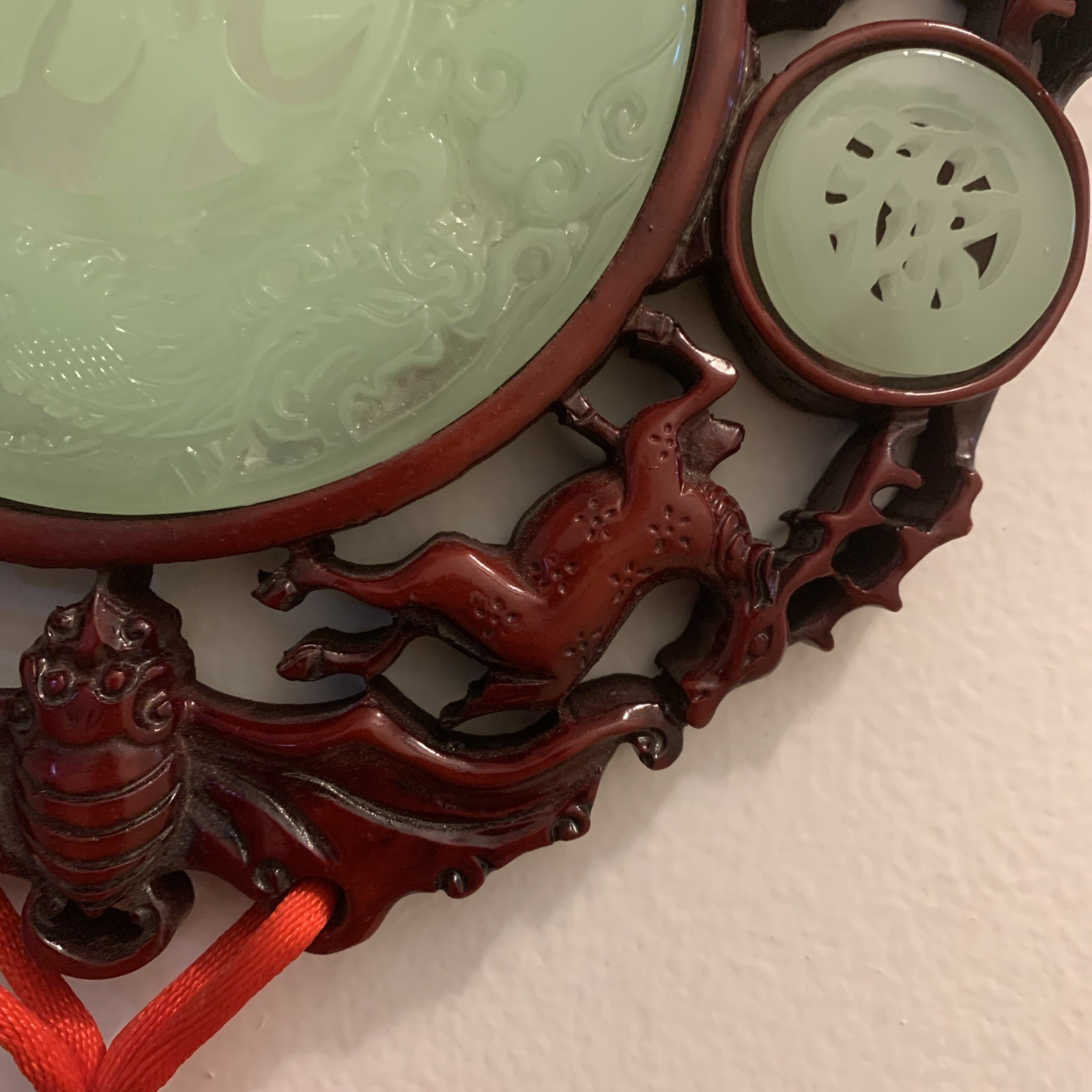 Green Red Knot hanging wall 8 1/2”Medallion w/tassels 40” long Resin Faux Jade.