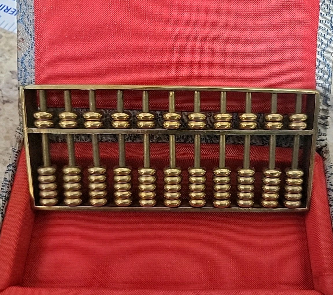 Vintage 1980’s Metal abacus paperweight in original box