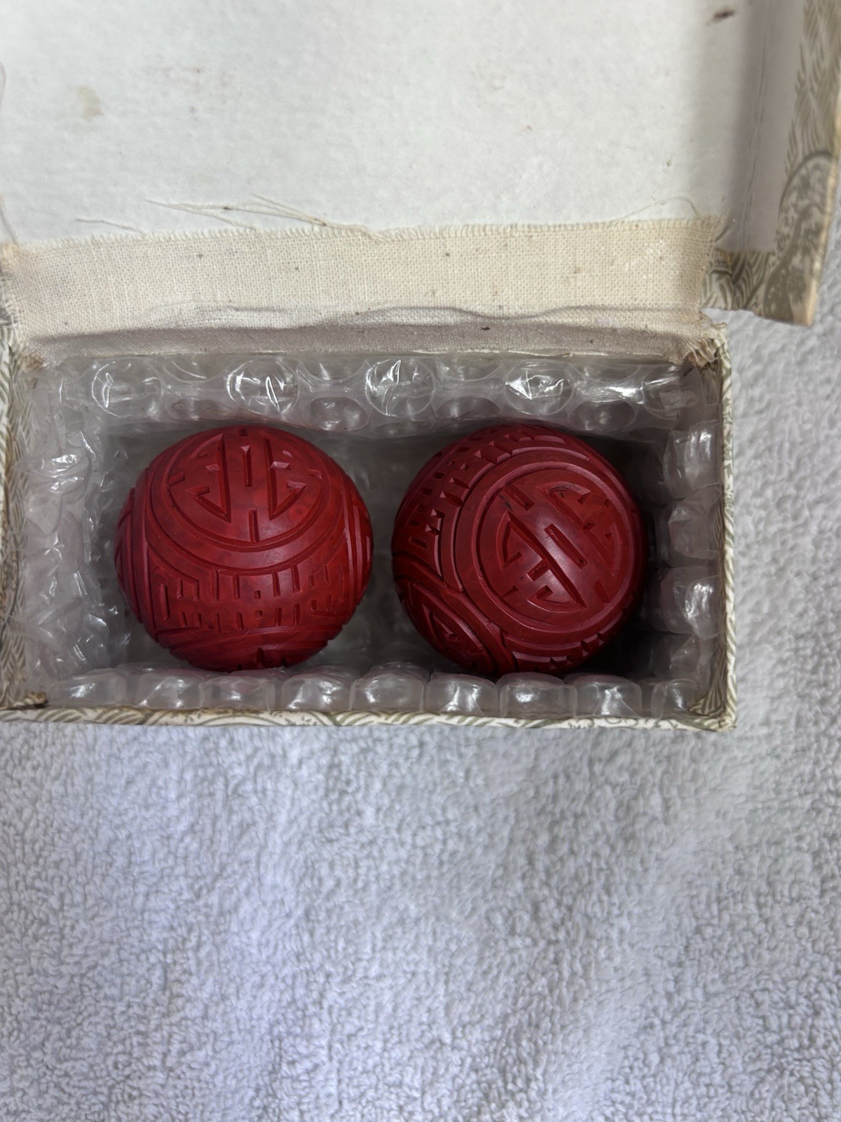 Red Chinese Carved Baoding Balls. Made/purchased in People’s Republic of China.