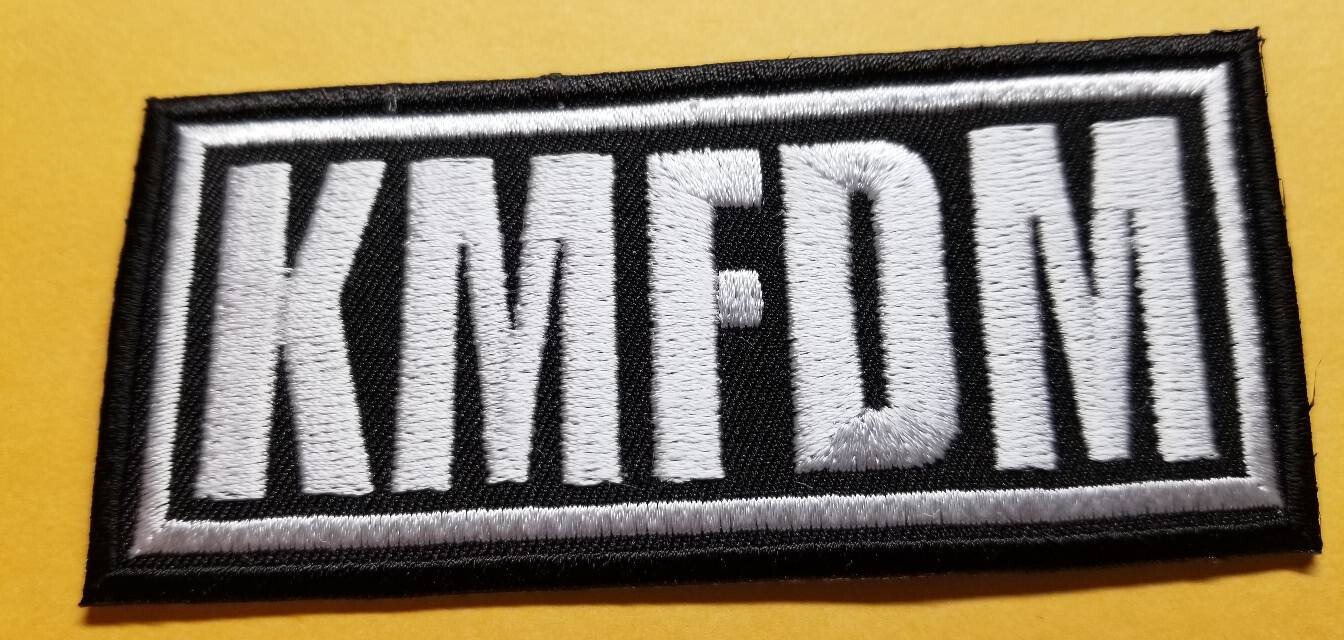 KMFDM Embroidered Patch approx 1.75×3.75″