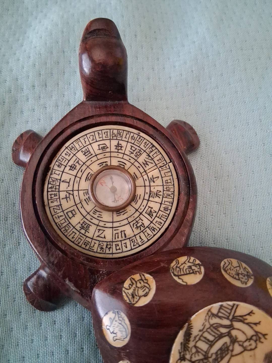 carved wood turtle with enlayed compass and chinese carved symbols