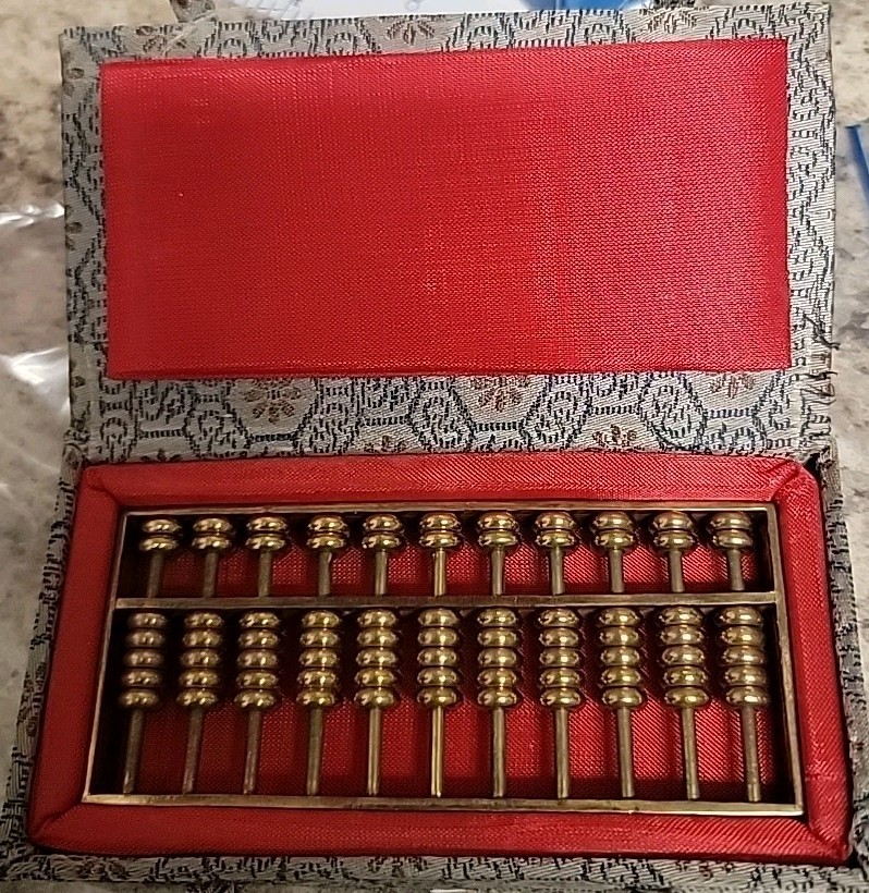 Vintage 1980’s Metal abacus paperweight in original box