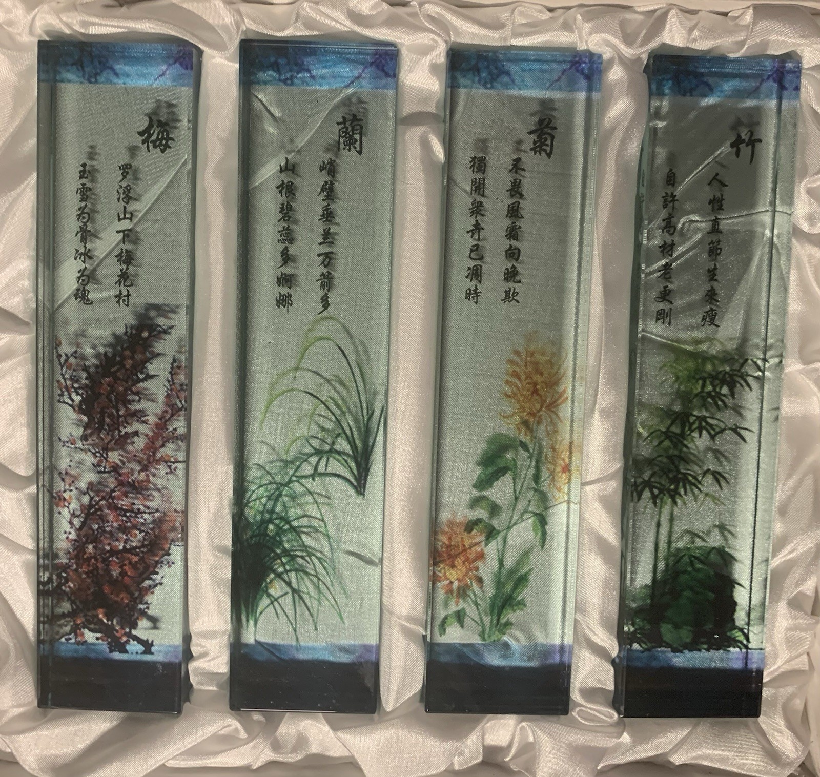 Set of 4 glass Chinese paperweights, each with hand-painted design & text.