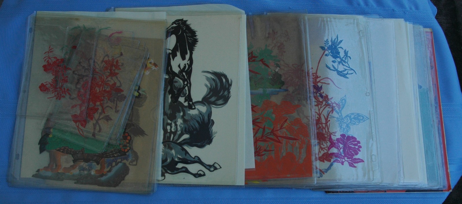 Vintage Lot of about 70 Chinese Paper Cuts in Plastic Protector Sheets Plus Book