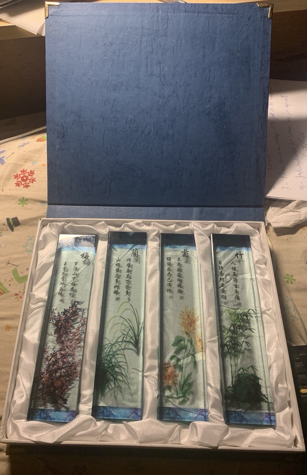 Set of 4 glass Chinese paperweights, each with hand-painted design & text.