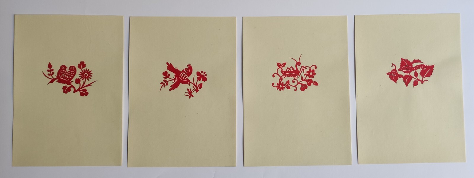 VINTAGE PORTFOLIO ALBUM WITH 16 CHINESE PAPER-CUTS – 1955