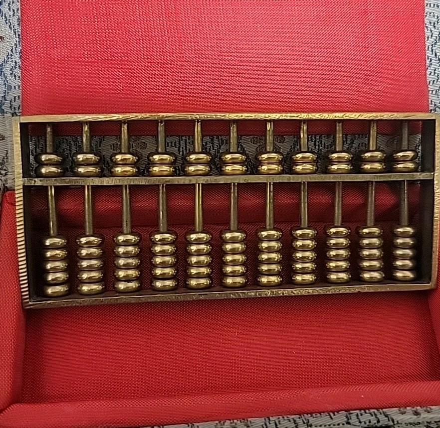 Vintage 1980’s Metal abacus paperweight in original box