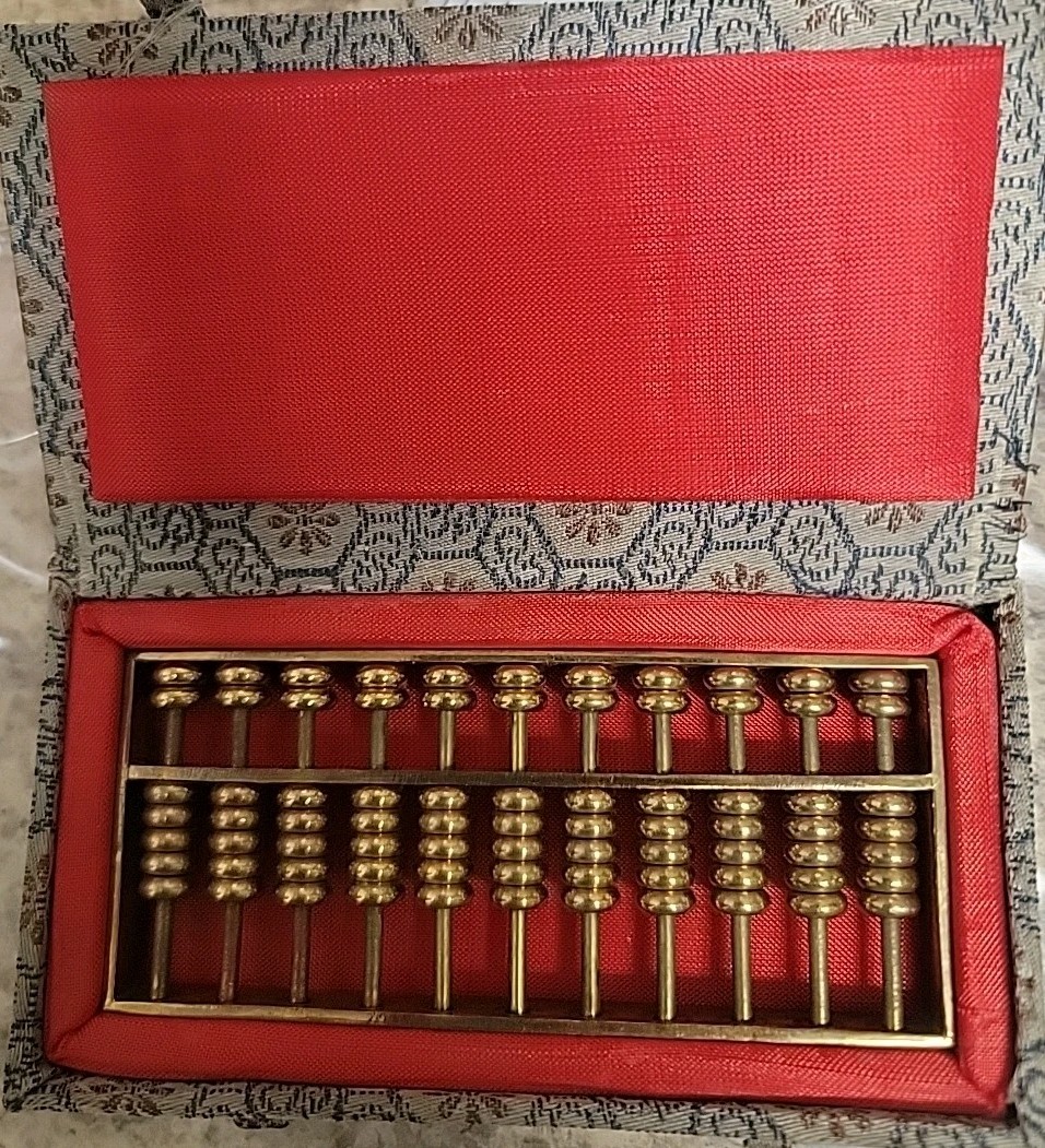 Vintage 1980’s Metal abacus paperweight in original box