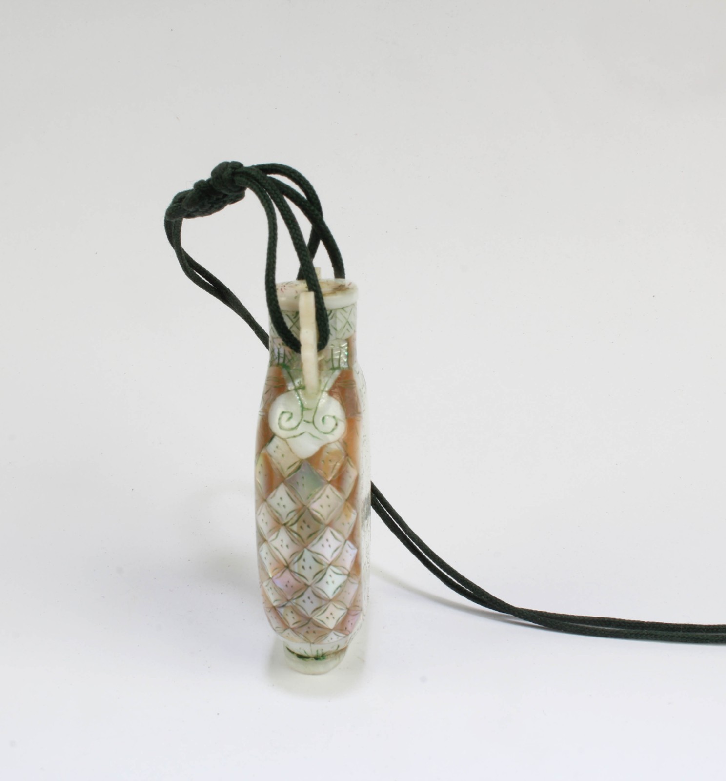 A Mother-of-Pearl Snuff Bottle, attached to a strine
