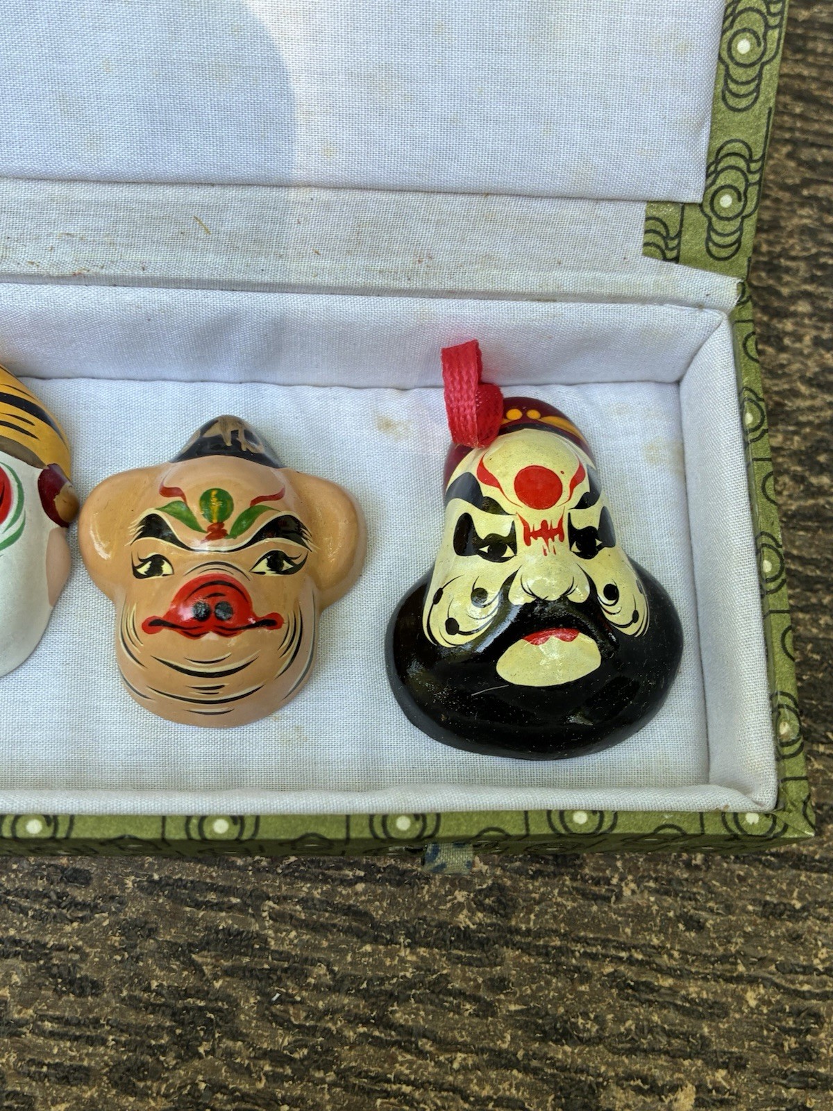 Chinese carved lacquer medallion and ceramic face mask miniatures
