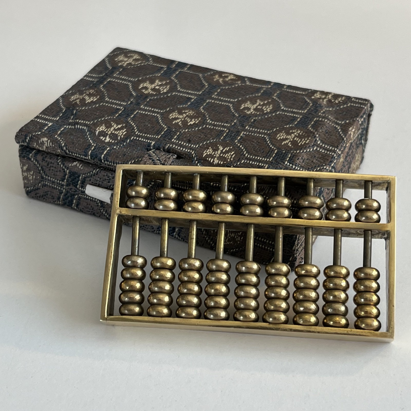 Vintage Miniature Brass Chinese Suanpan 9 Rod Abacus With Silk Brocade Box.