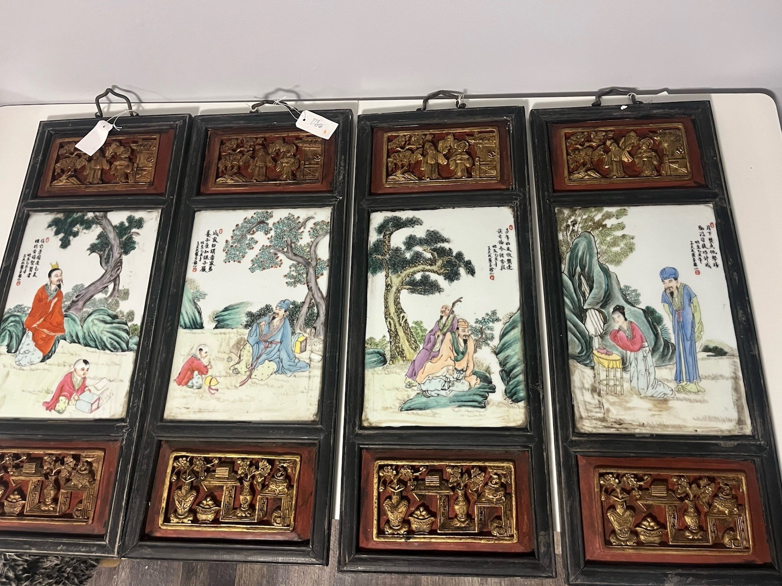 Four Chinese Family Rose Porcelain, Carved And Painted Wood Panel Wall Hangings